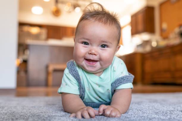 Cute baby on carpet | Bell County Flooring
